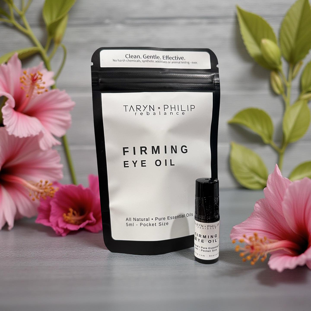 Taryn x Philip Firming Eye Oil packaging with flowers in the background